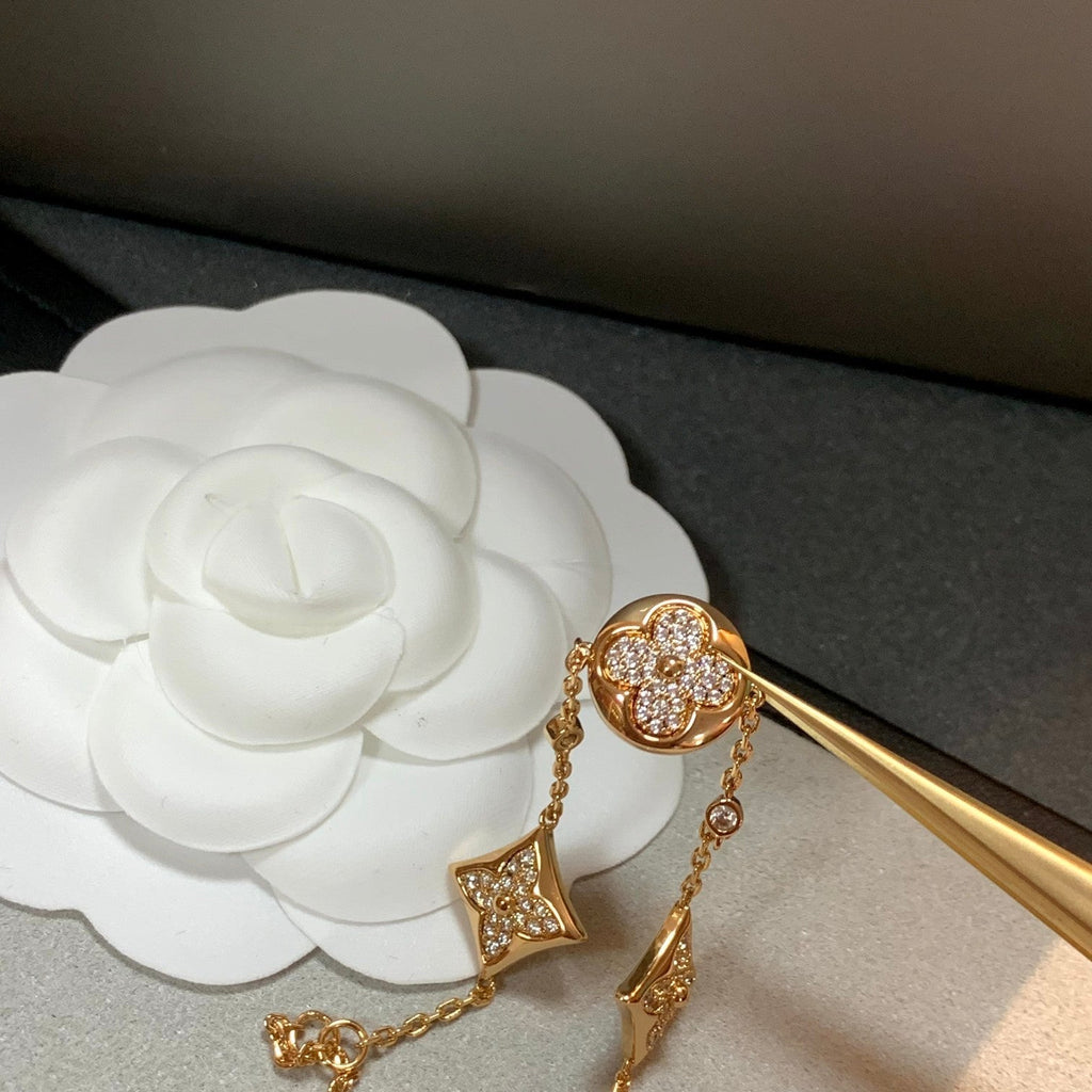 ¡®Lumi¡¯STAR AND SUN 4 MOTIFS GOLD DIAMONDS BRACELET