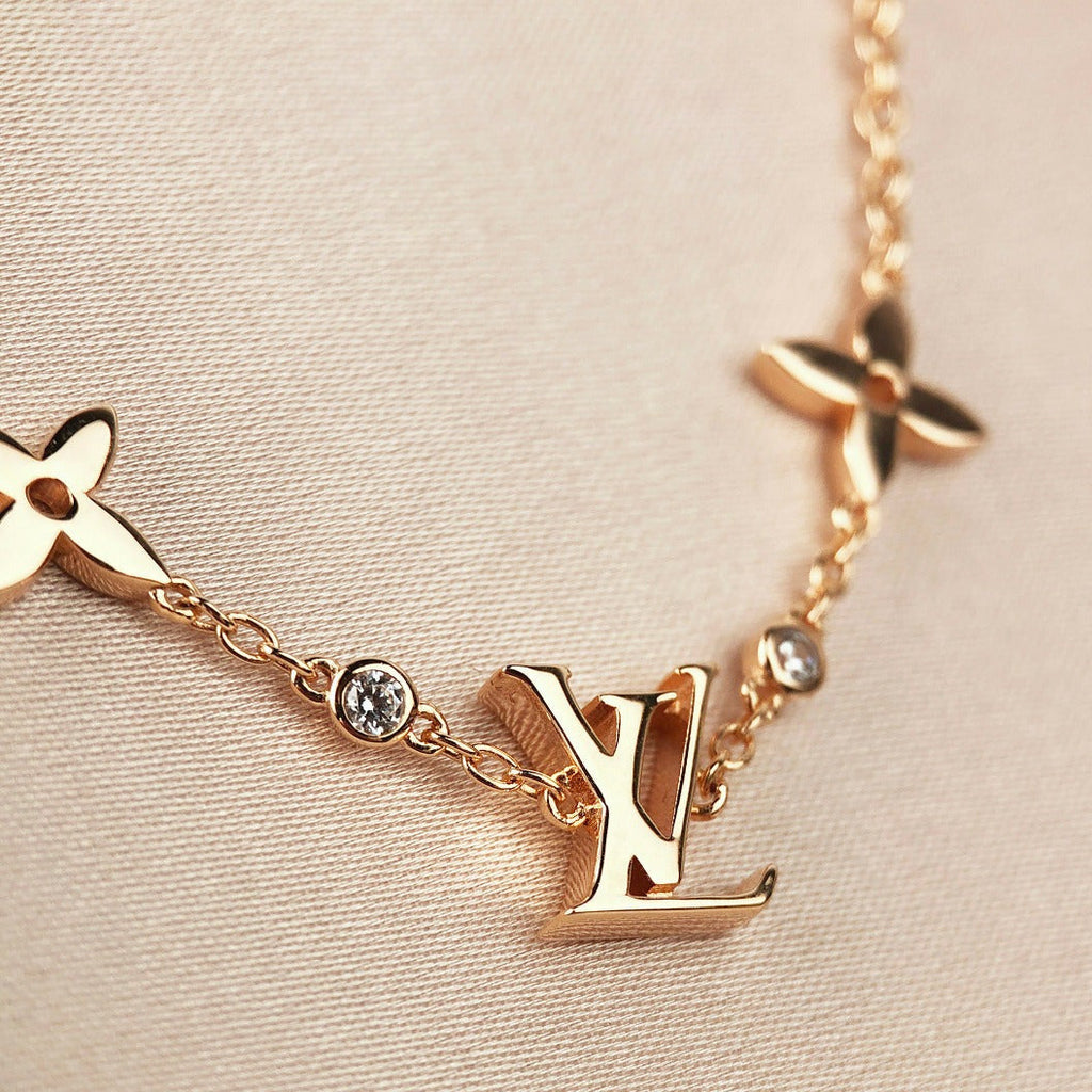 ¡®Lumi¡¯STAR AND SUN 7 MOTIFS GOLD BRACELET