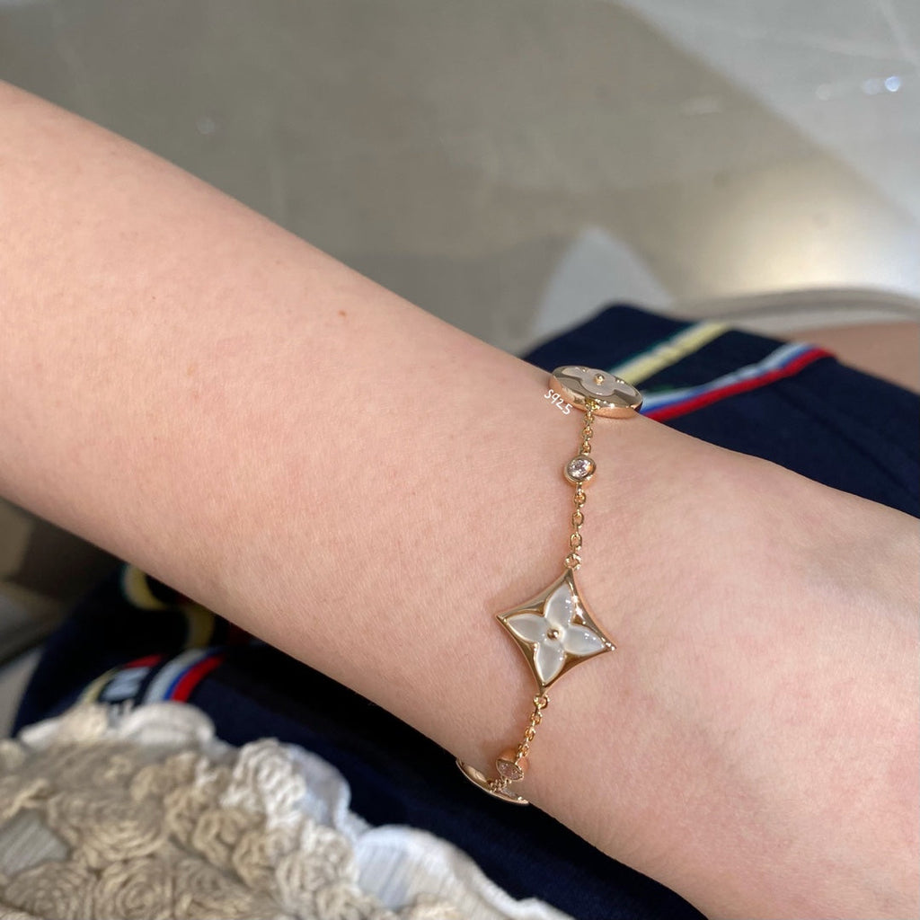 ¡®Lumi¡¯STAR AND SUN 4 MOTIF WHITE MOP PINK GOLD BRACELET